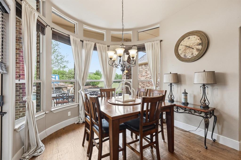 406 Spurgin Road Lucas, TX 75002 - Photo 14 of 39 Dining room with light wood-style flooring and suspended lighting