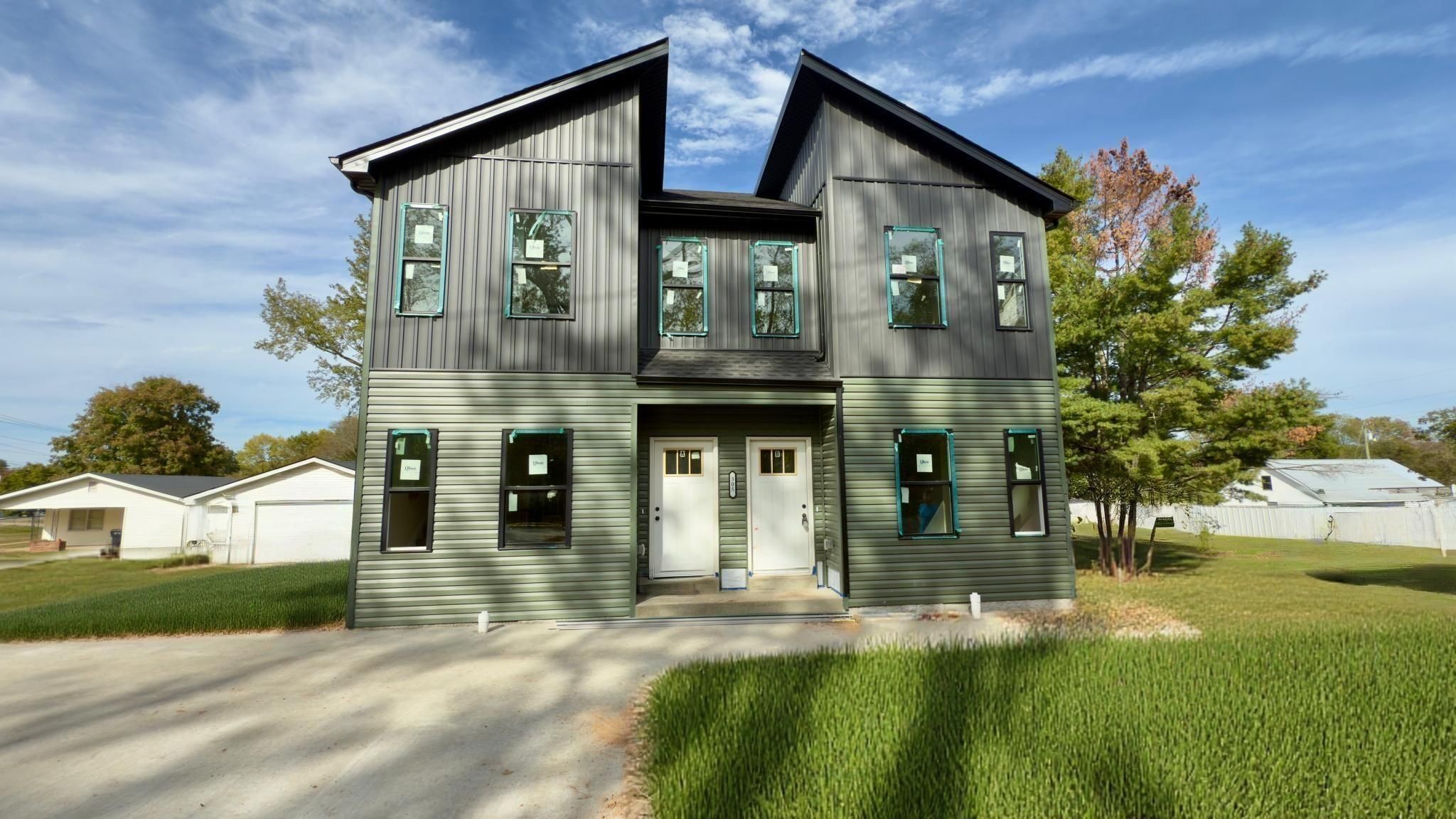 a front view of a house with a yard
