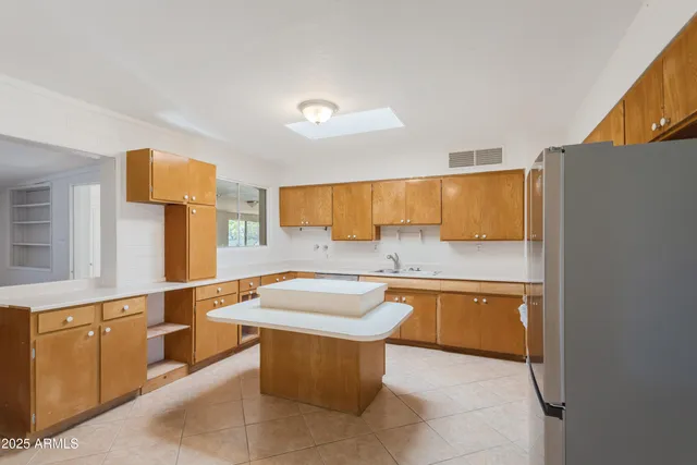 a kitchen with stainless steel appliances granite countertop a sink and cabinets