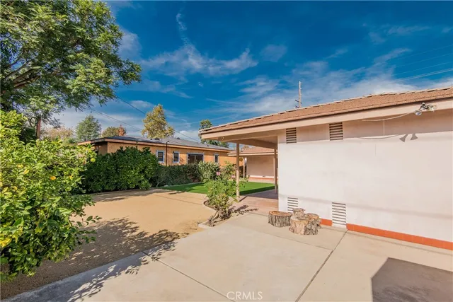 a view of a chair and tables in the patio