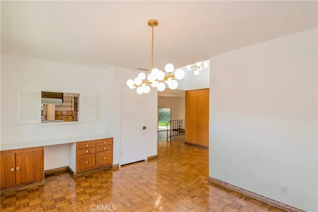 a view of a hallway with a chandelier