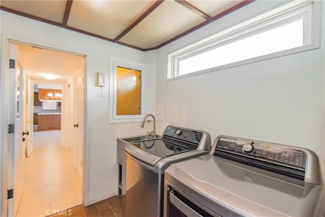 a kitchen with a stove a refrigerator and a stove top oven