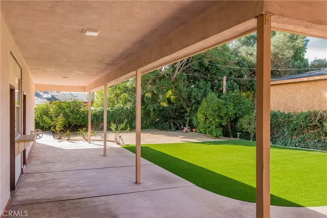 a view of a patio with a backyard