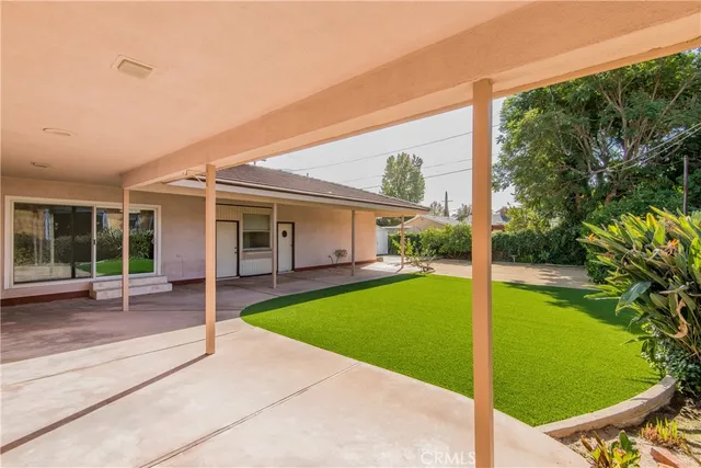 a view of a house with backyard porch and a small cabin