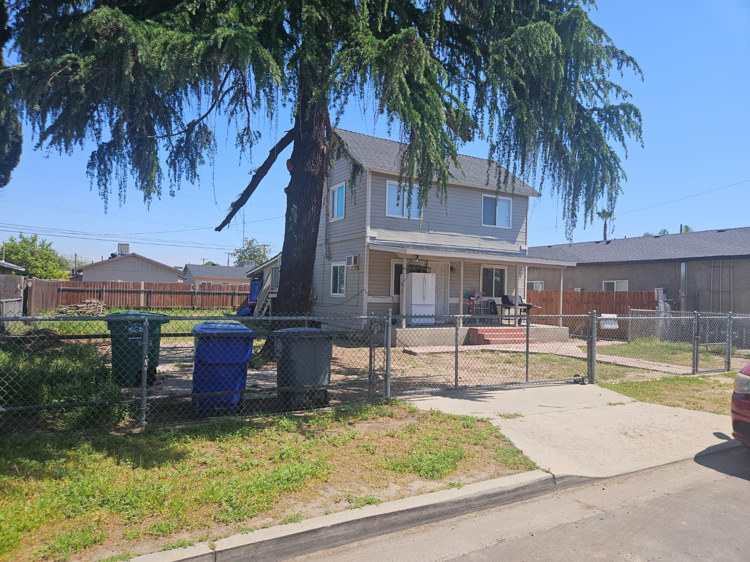 a swimming pool with outdoor seating and yard