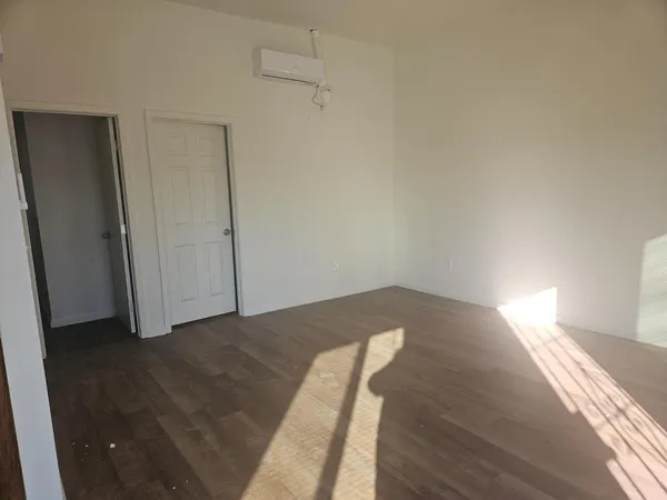 a bathroom with a toilet and a bathtub