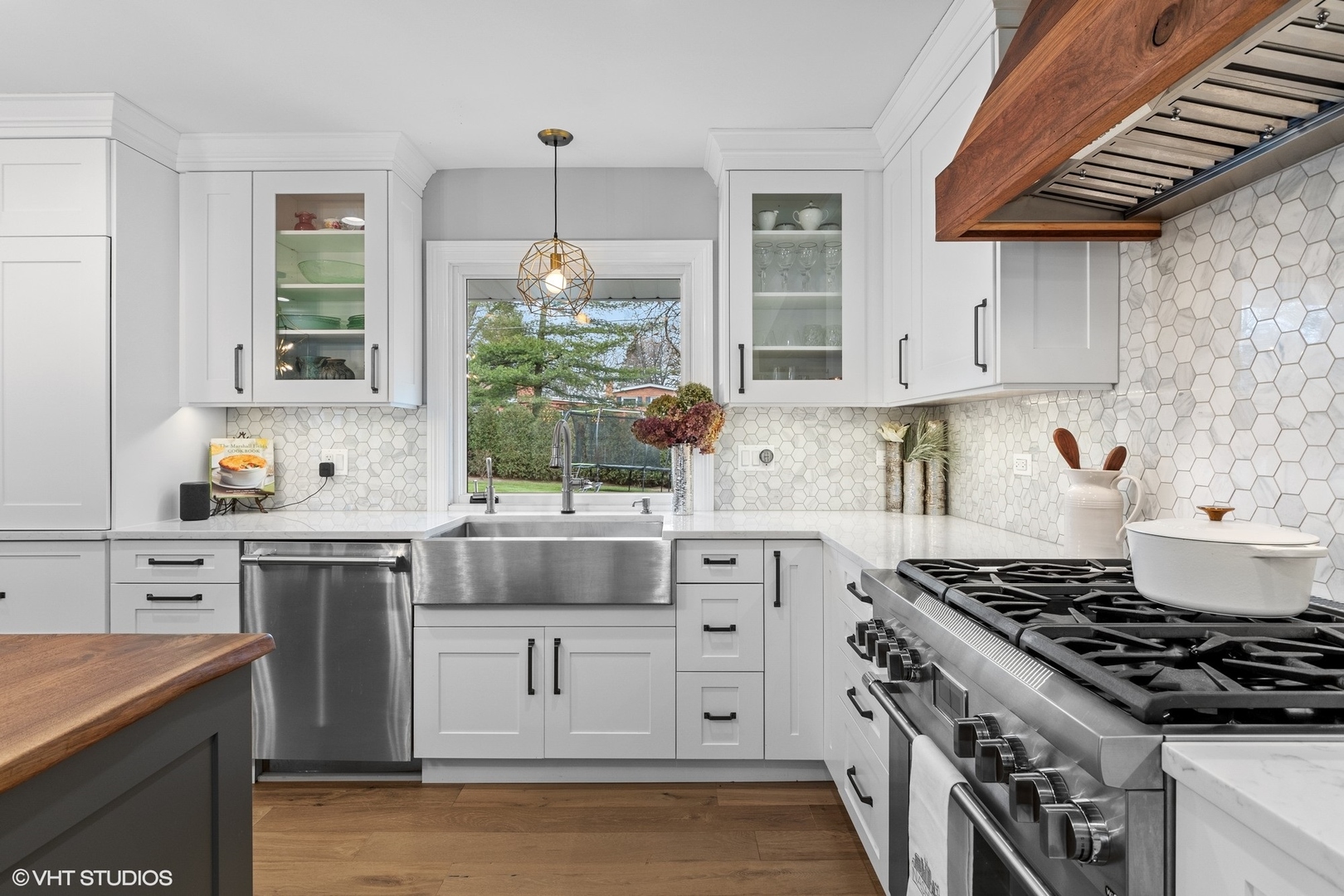 106 Park Lane Lake Bluff, IL 60044 - Photo 11 of 36 a kitchen with stainless steel appliances a stove and white cabinets
