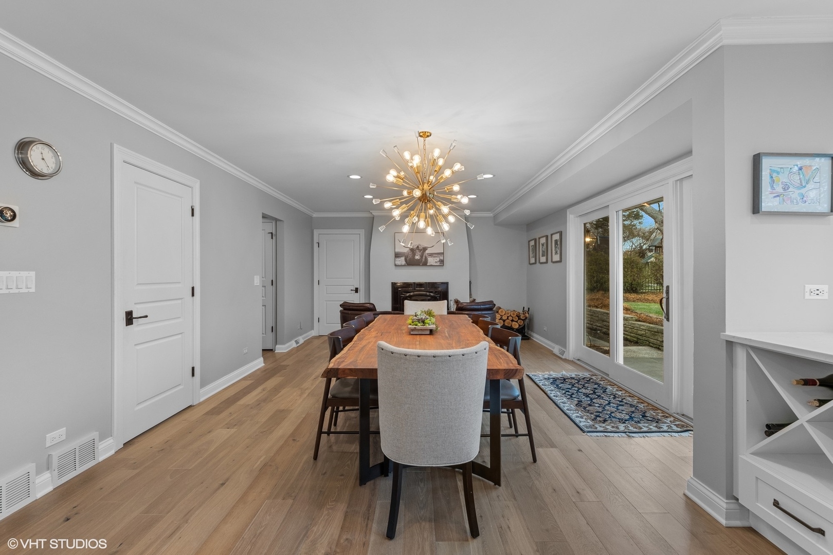 106 Park Lane Lake Bluff, IL 60044 - Photo 16 of 36 a dining room with wooden floor a chandelier a wooden table and chairs
