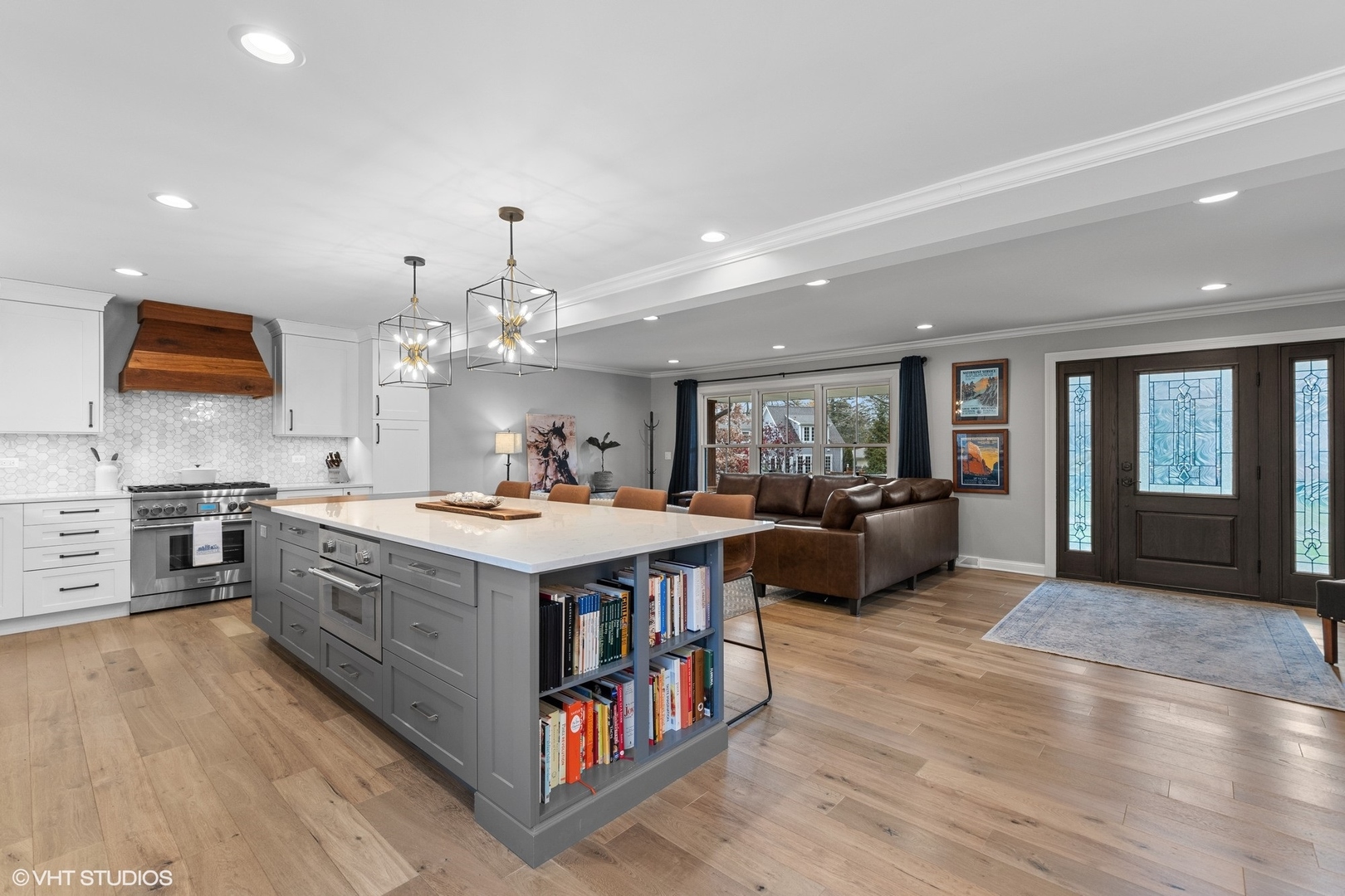 106 Park Lane Lake Bluff, IL 60044 - Photo 8 of 36 a large white kitchen with stainless steel appliances granite countertop a stove and a flat screen tv