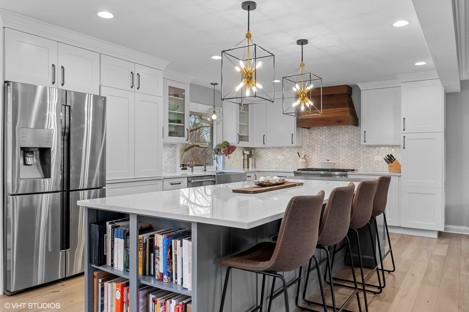 106 Park Lane Lake Bluff, IL 60044 - Photo 9 of 36 a kitchen with stainless steel appliances granite countertop a refrigerator a stove a sink dishwasher a oven a dining table and chairs with wooden floor
