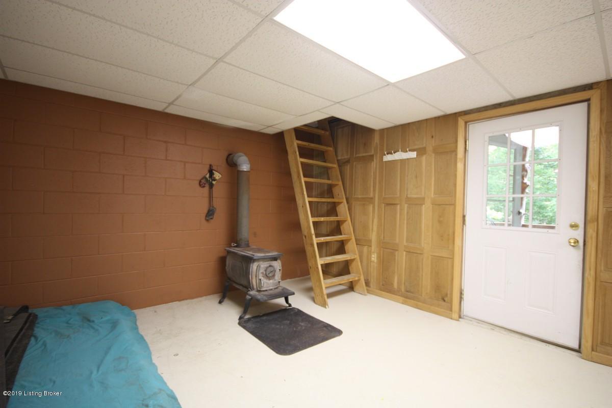 3974 Grayson Springs Road Clarkson, KY 42726 - Photo 14 of 49 Lower Level Living Room Wood Stove