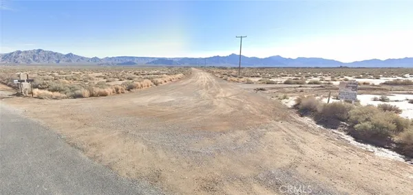 a view of a road with an ocean view