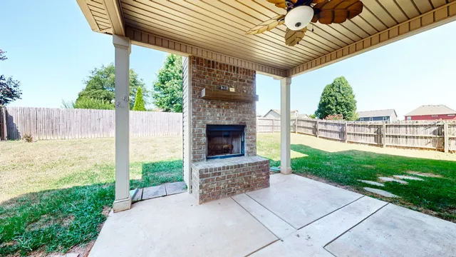 a house view with a sitting space and garden