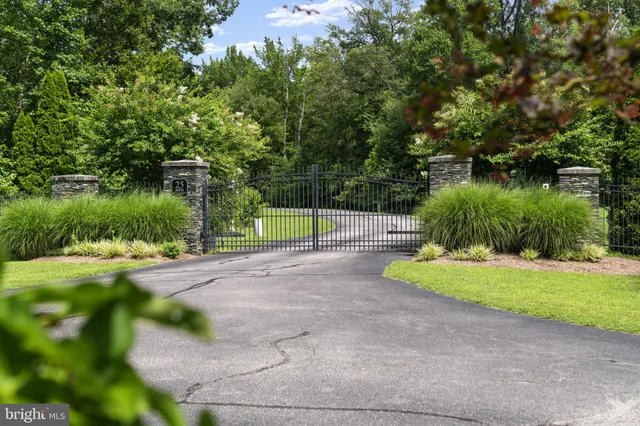 a street sign that is sitting in front of a tree