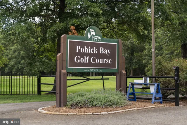 a front view of a house with glass windows and table