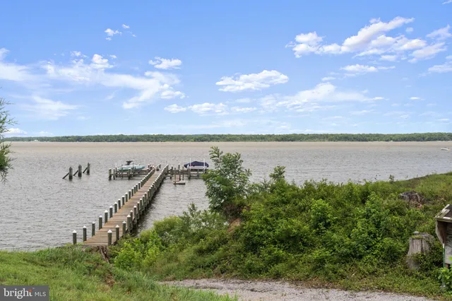 a view of a lake with a yard