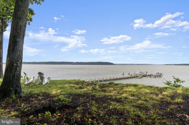 a view of a lake with houses in the back