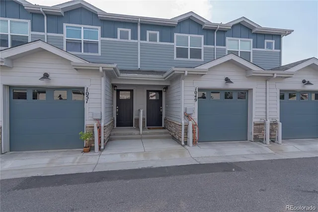 a front view of a house with a garage