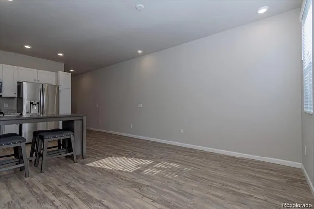 a view of kitchen with furniture and wooden floor