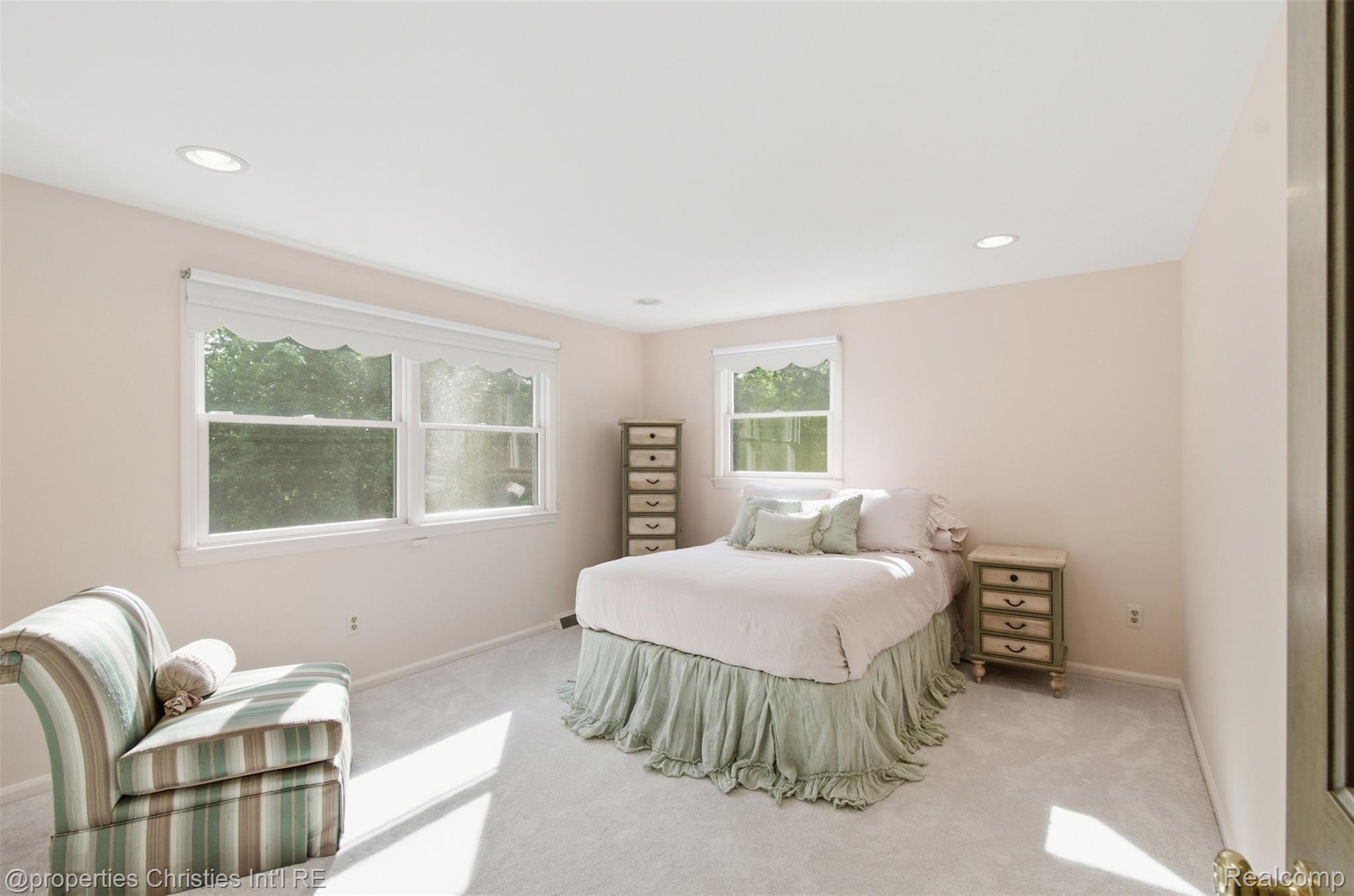 25235 Canterbury Road Franklin, MI 48025 - Photo 33 of 56 Spacious bedroom 3 on the second floor featuring light-colored walls and soft carpeting