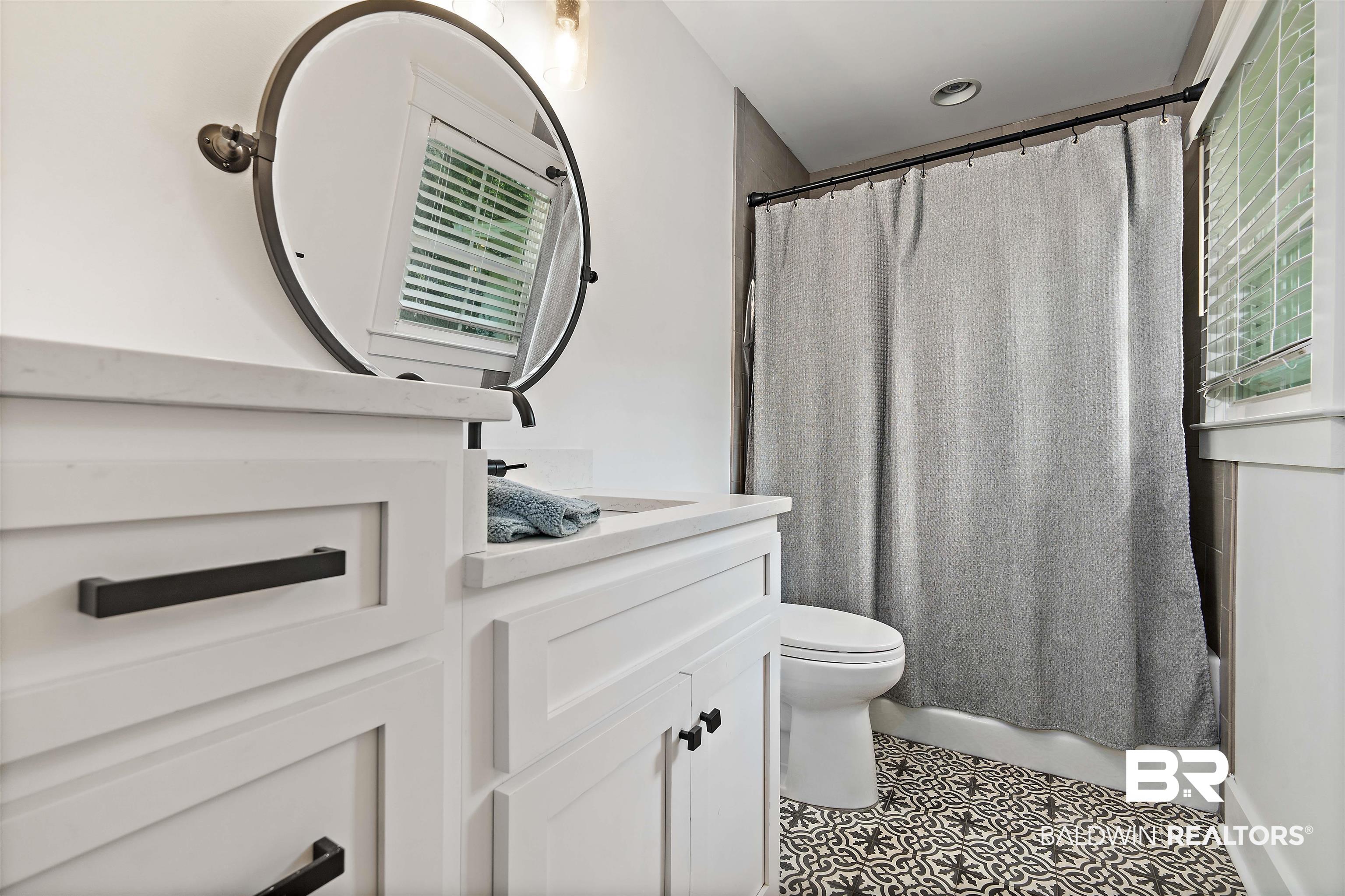 3808 Claridge Road North Mobile, AL 36608 - Photo 25 of 43 Bathroom featuring tile patterned floors, toilet, and vanity
