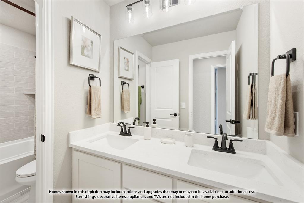 5512 Montex Road Denton, TX 76226 - Photo 25 of 25 a bathroom with a sink vanity mirror and toilet