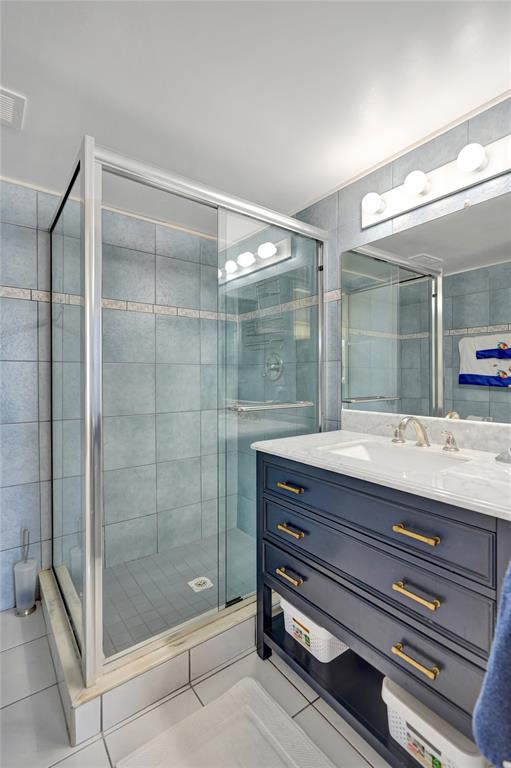 1051 Hillsboro Mile, Unit 307E Hillsboro Beach, FL 33062 - Photo 18 of 30 a bathroom with a shower and a sink