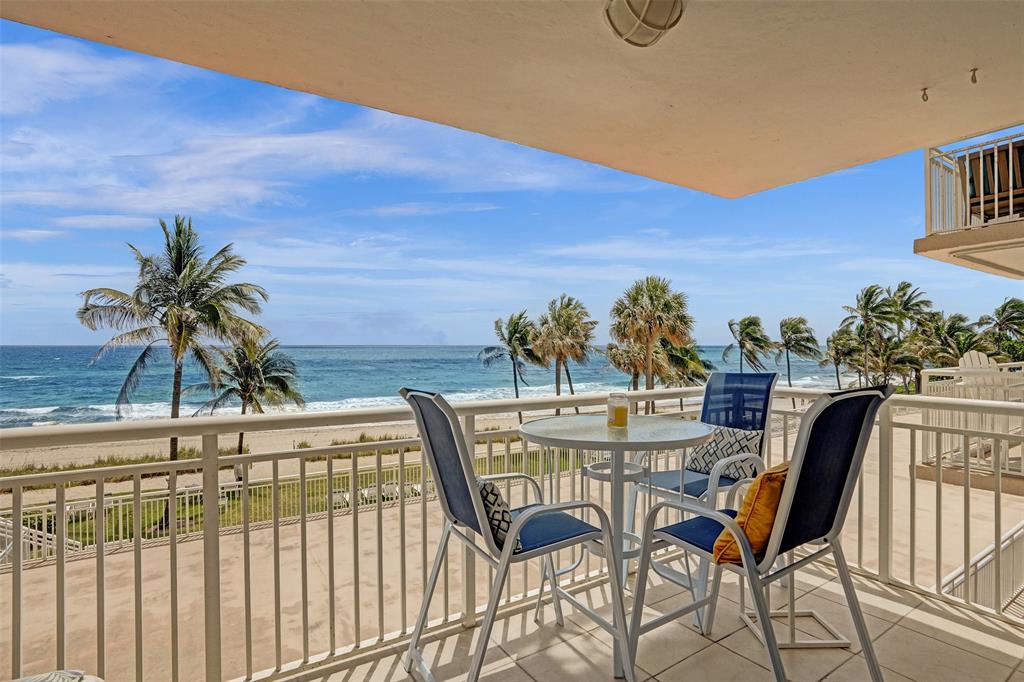 1051 Hillsboro Mile, Unit 307E Hillsboro Beach, FL 33062 - Photo 19 of 30 a view of a chairs and table on the terrace