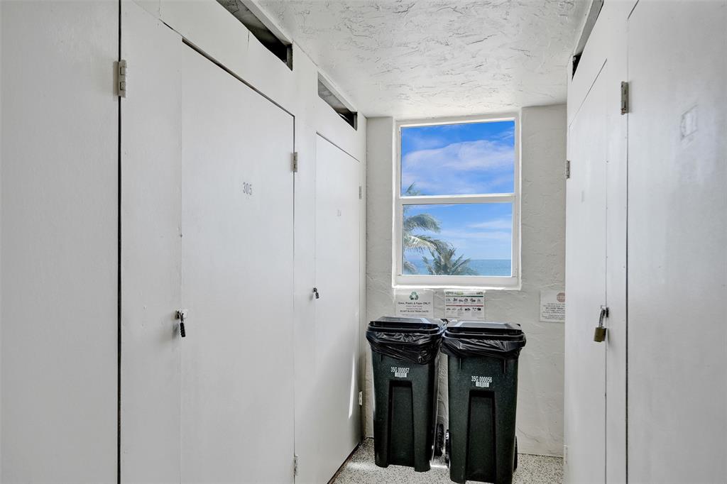 1051 Hillsboro Mile, Unit 307E Hillsboro Beach, FL 33062 - Photo 24 of 30 a view of a hallway with wooden floor