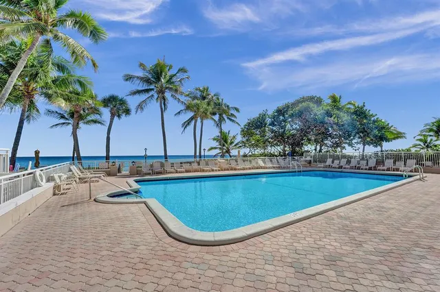 a view of a palm trees in front of house