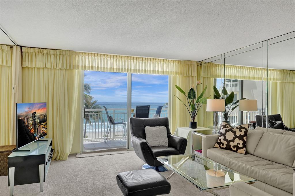 1051 Hillsboro Mile, Unit 307E Hillsboro Beach, FL 33062 - Photo 3 of 30 a living room with furniture and a large window