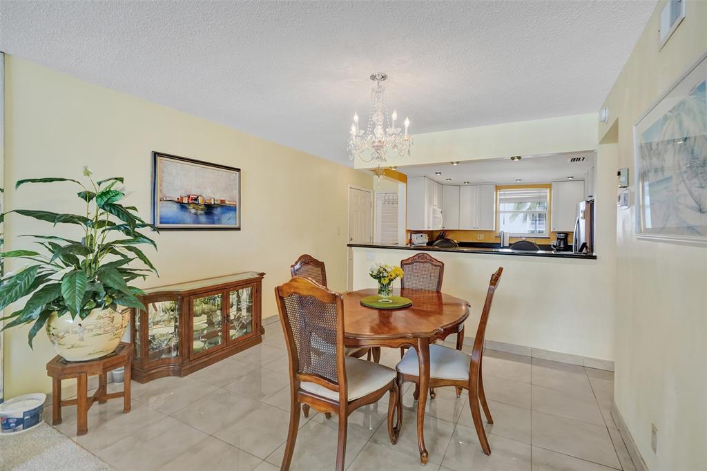 1051 Hillsboro Mile, Unit 307E Hillsboro Beach, FL 33062 - Photo 8 of 30 a dining room with furniture and window