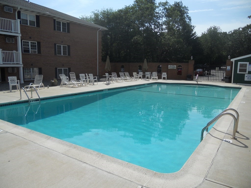 65 Leonard Road, Unit 65 Boxborough, MA 01719 - Photo 12 of 14 a view of swimming pool having outdoor seating