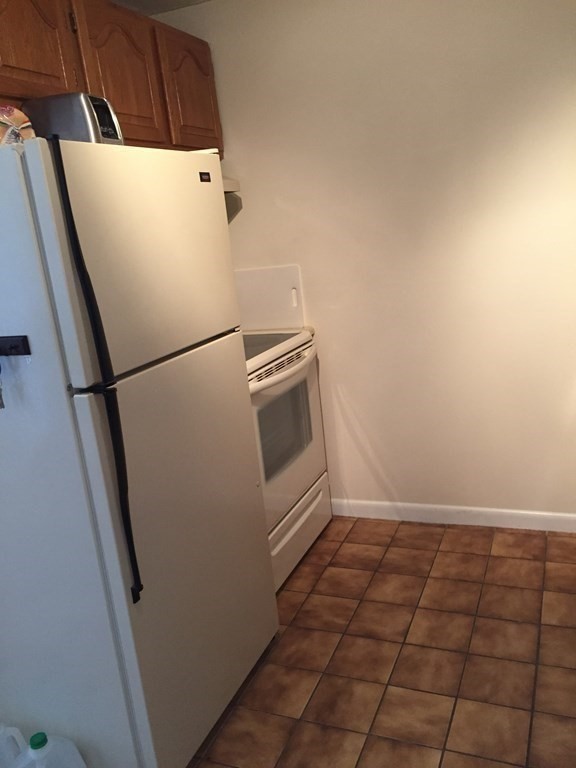 65 Leonard Road, Unit 65 Boxborough, MA 01719 - Photo 9 of 14 a view of a storage and utility room with washer and dryer