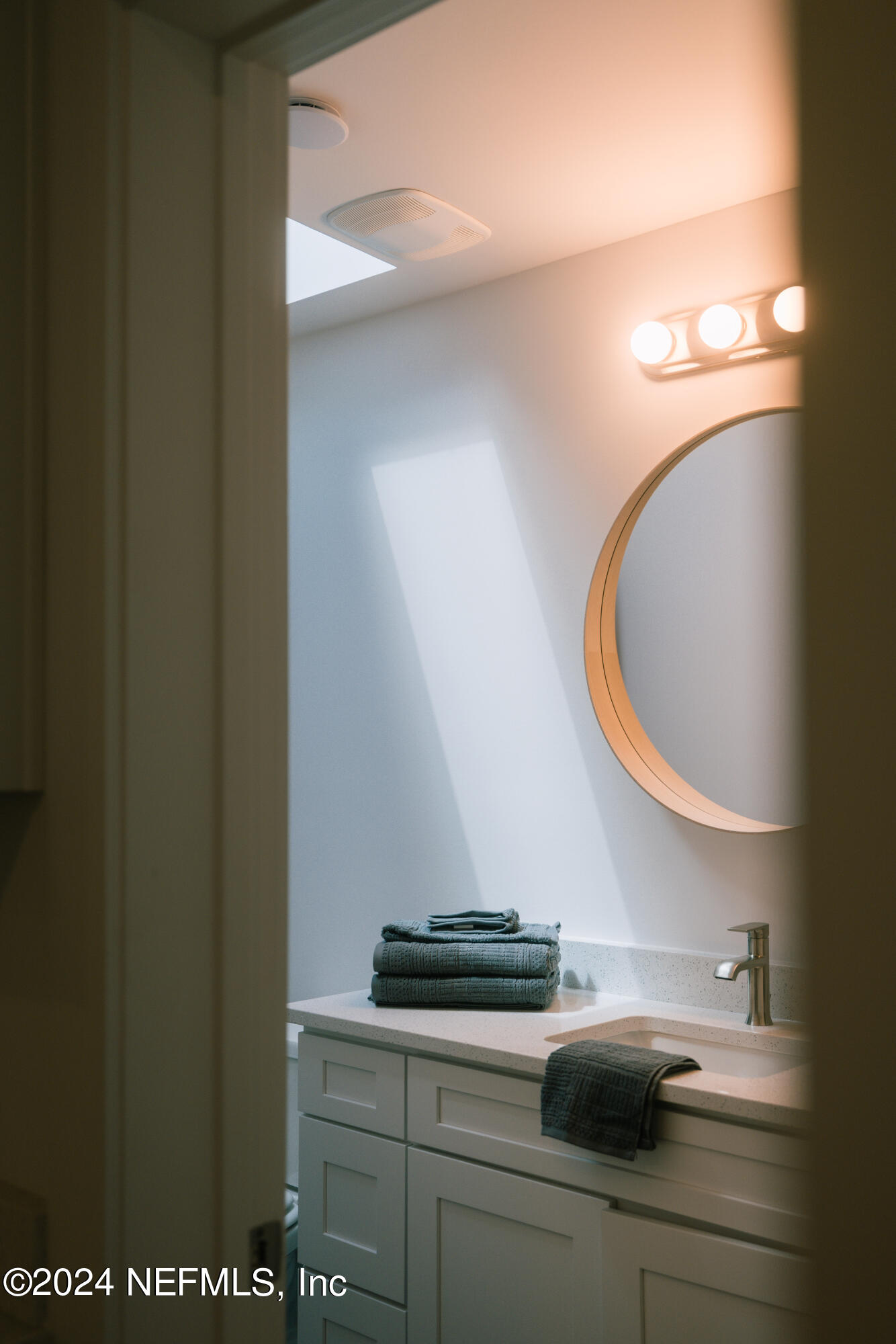 793 Chapin Street St. Augustine, FL 32084 - Photo 13 of 32 a bathroom with a sink and a mirror