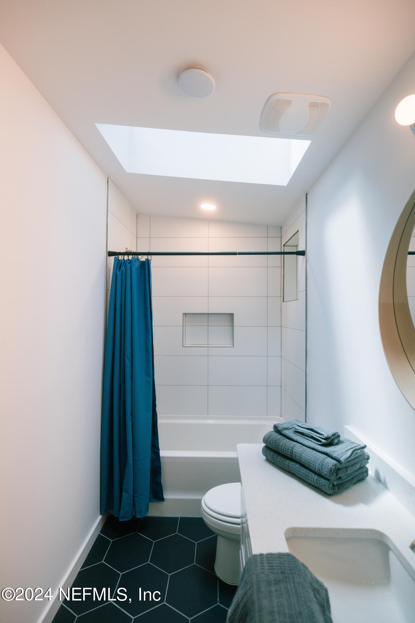 793 Chapin Street St. Augustine, FL 32084 - Photo 15 of 32 a bathroom with a sink a toilet and shower