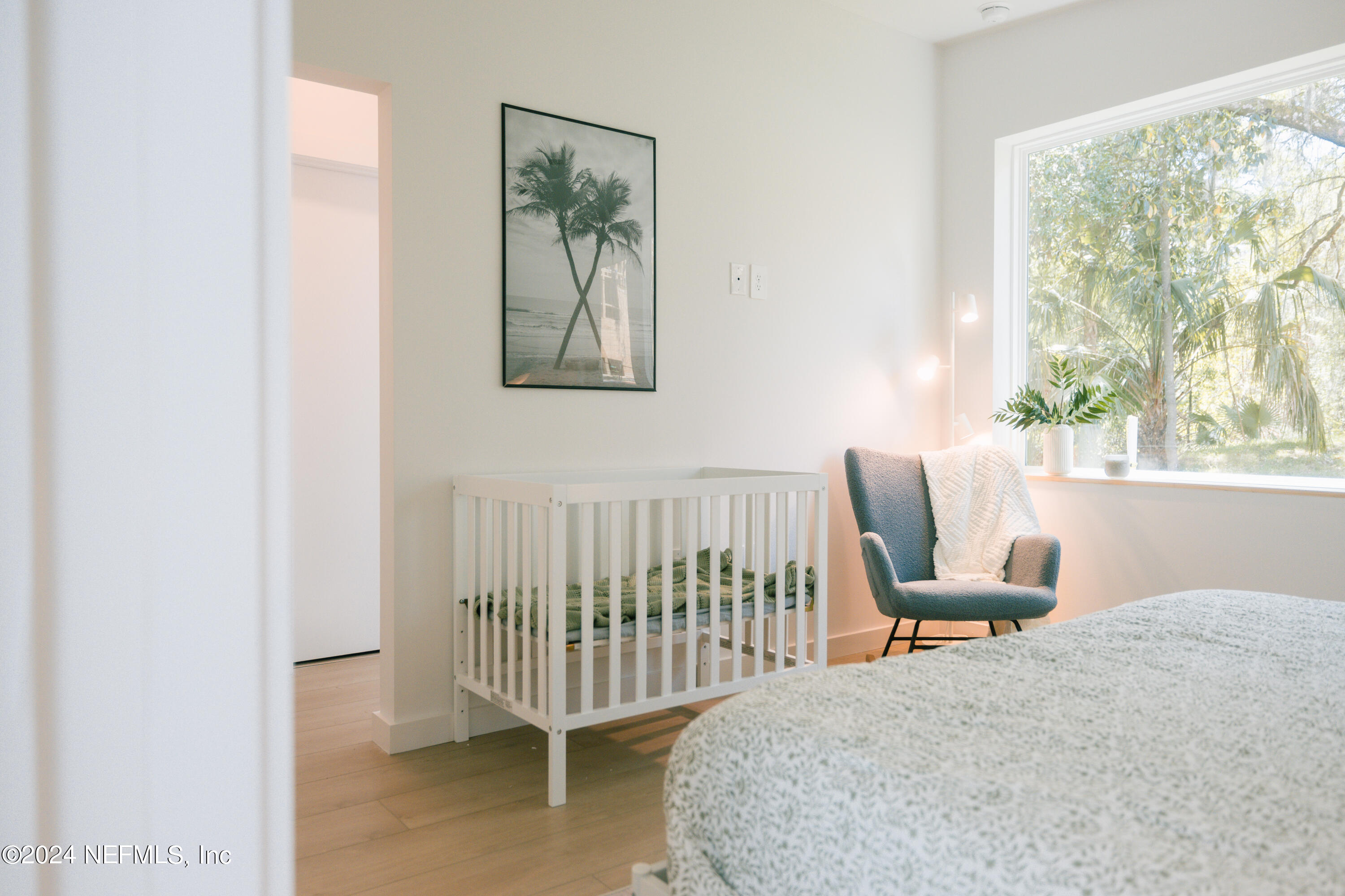 793 Chapin Street St. Augustine, FL 32084 - Photo 22 of 32 a bedroom with a bed and a window