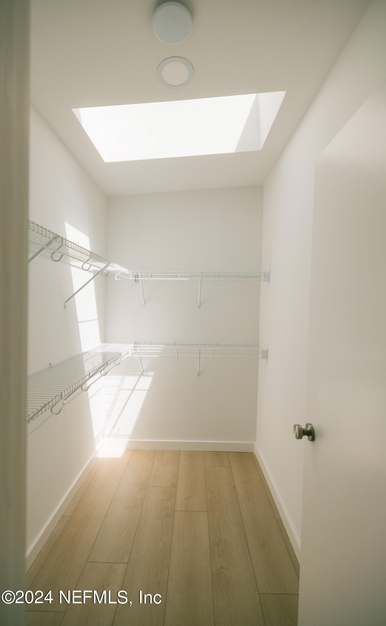 793 Chapin Street St. Augustine, FL 32084 - Photo 27 of 32 a view of a room with racks on the wall