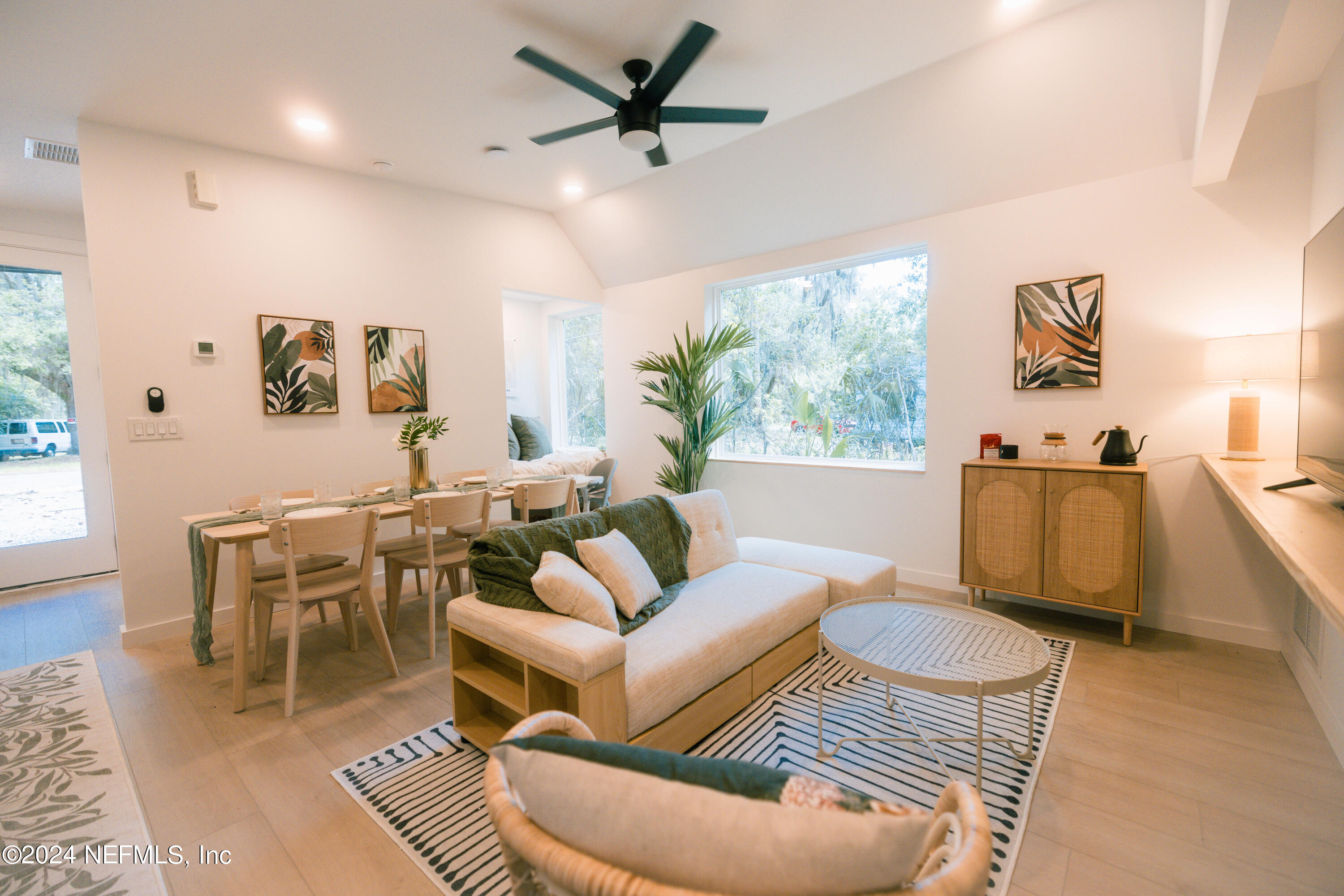 793 Chapin Street St. Augustine, FL 32084 - Photo 10 of 32 a living room with furniture kitchen view and a large window