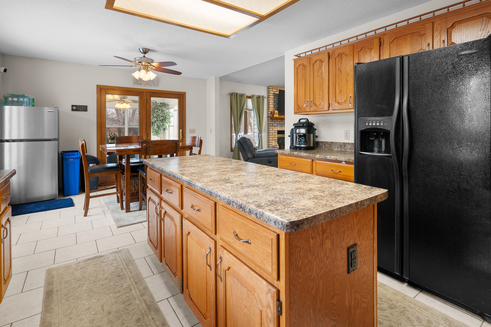6002 Oakbrook Road Davenport, IA 52806 - Photo 13 of 50 a kitchen with stainless steel appliances granite countertop a refrigerator and a stove top oven