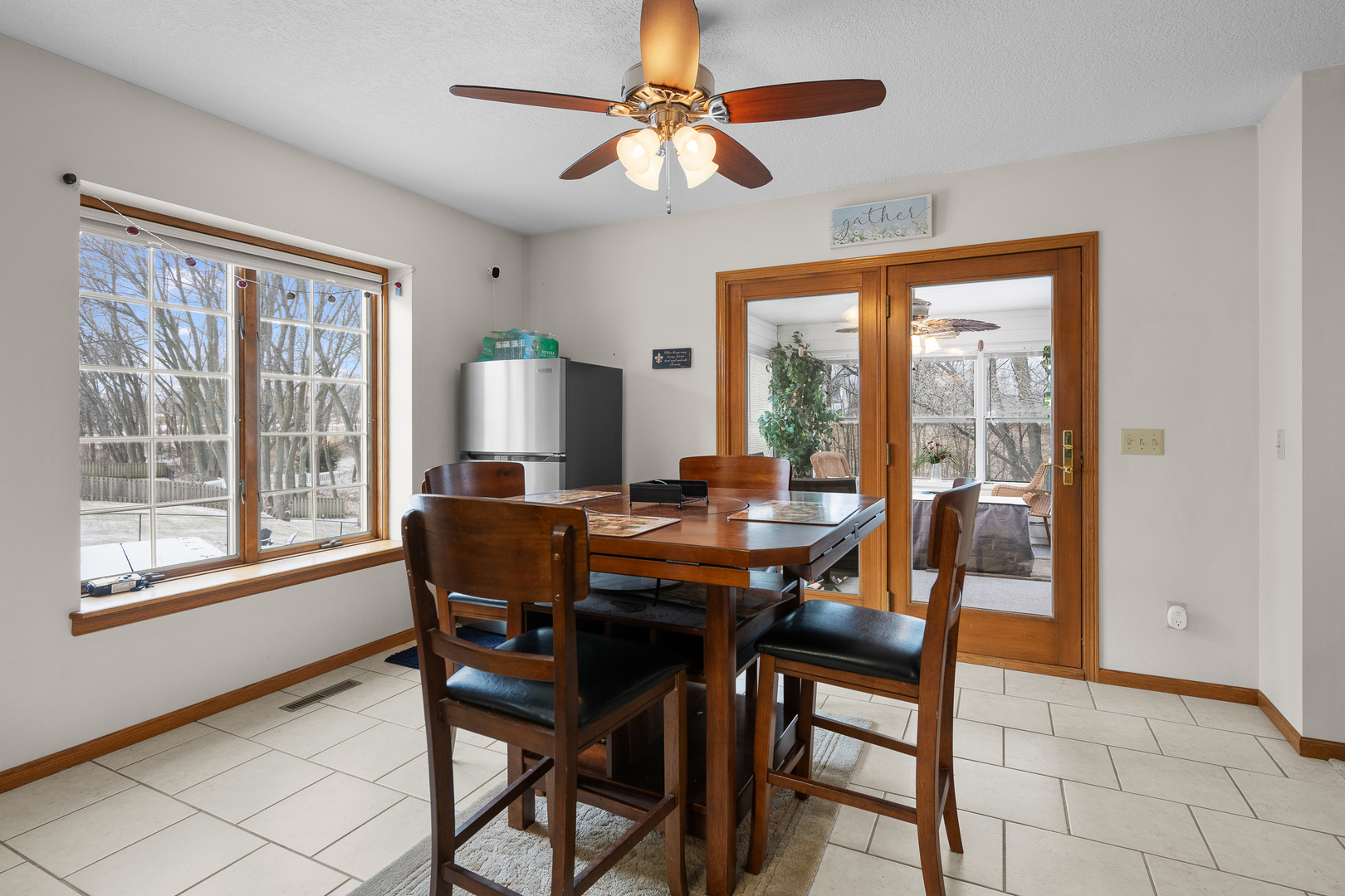 6002 Oakbrook Road Davenport, IA 52806 - Photo 15 of 50 a view of a dining room with furniture window and outside view