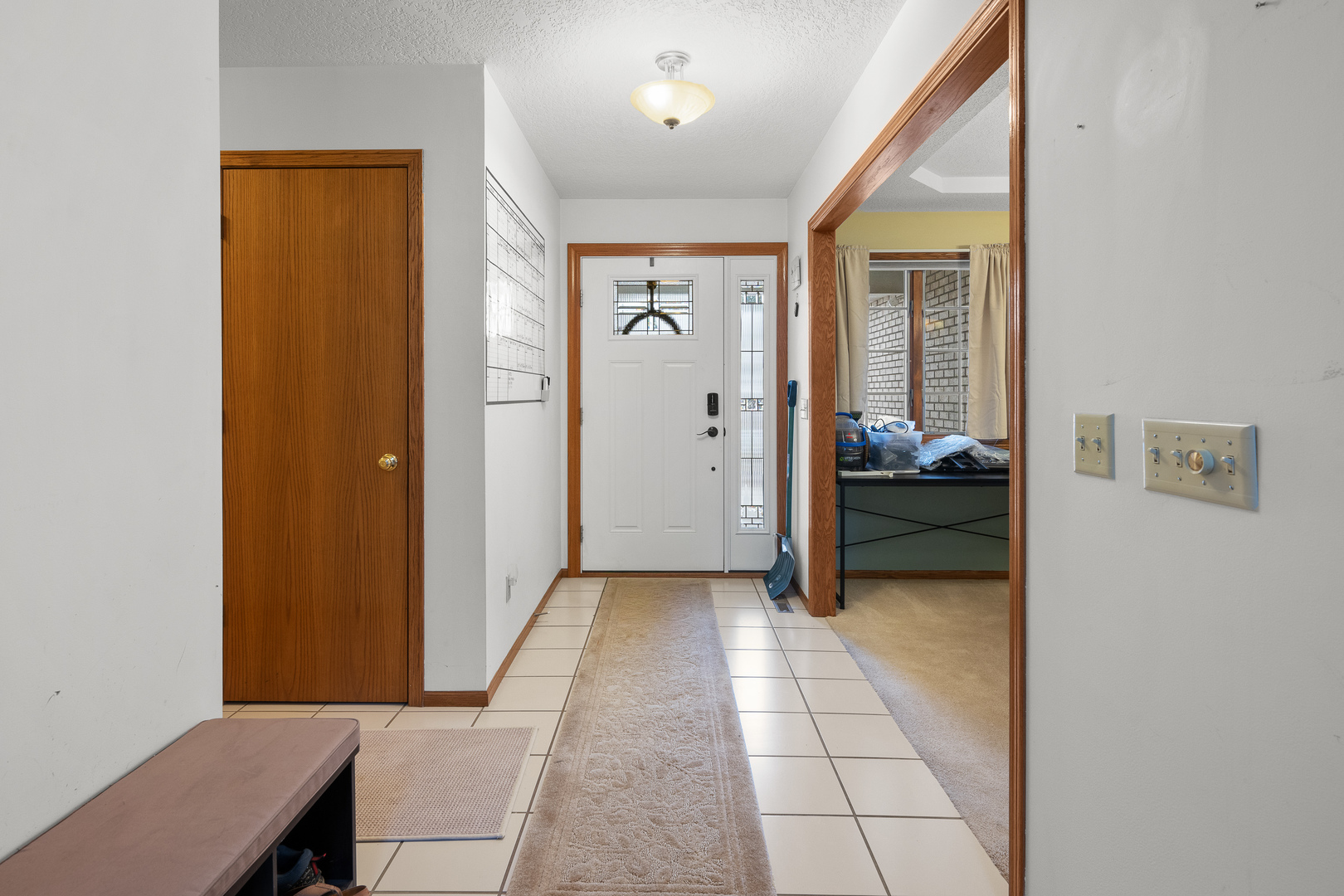 6002 Oakbrook Road Davenport, IA 52806 - Photo 16 of 50 a view of a hallway with wooden floor and a bedroom