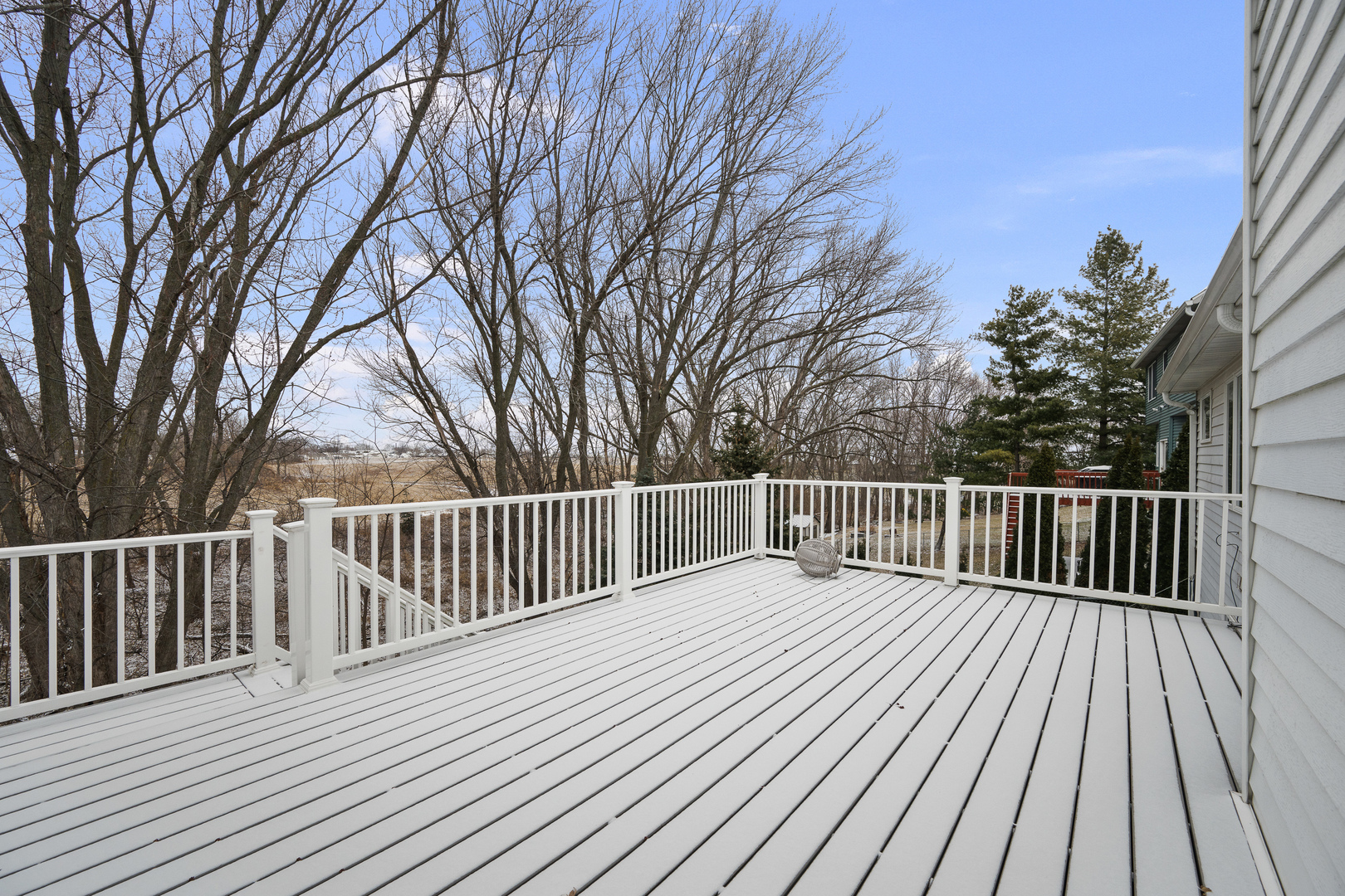 6002 Oakbrook Road Davenport, IA 52806 - Photo 22 of 50 a view of backyard with a deck and wooden floor
