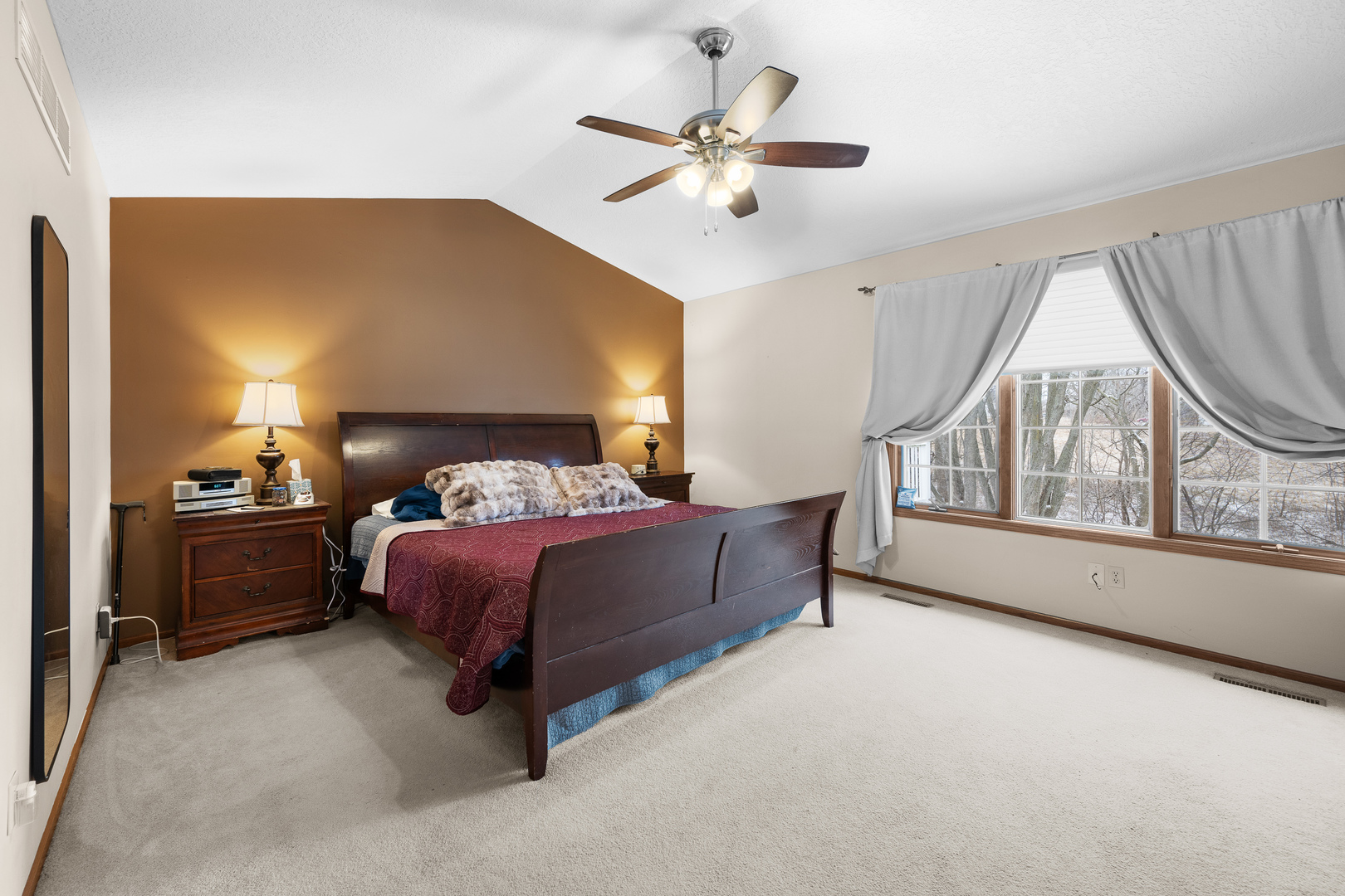 6002 Oakbrook Road Davenport, IA 52806 - Photo 25 of 50 a bed room with a bed and a chandelier