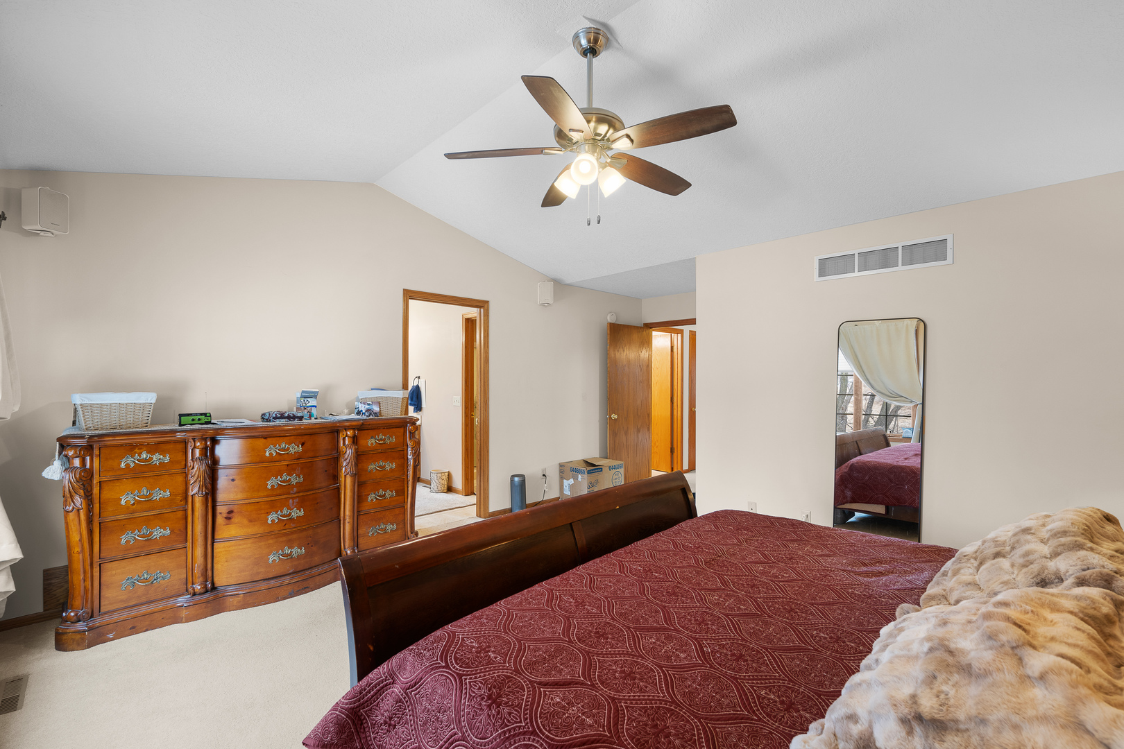 6002 Oakbrook Road Davenport, IA 52806 - Photo 26 of 50 a bedroom with a bed and wooden floor