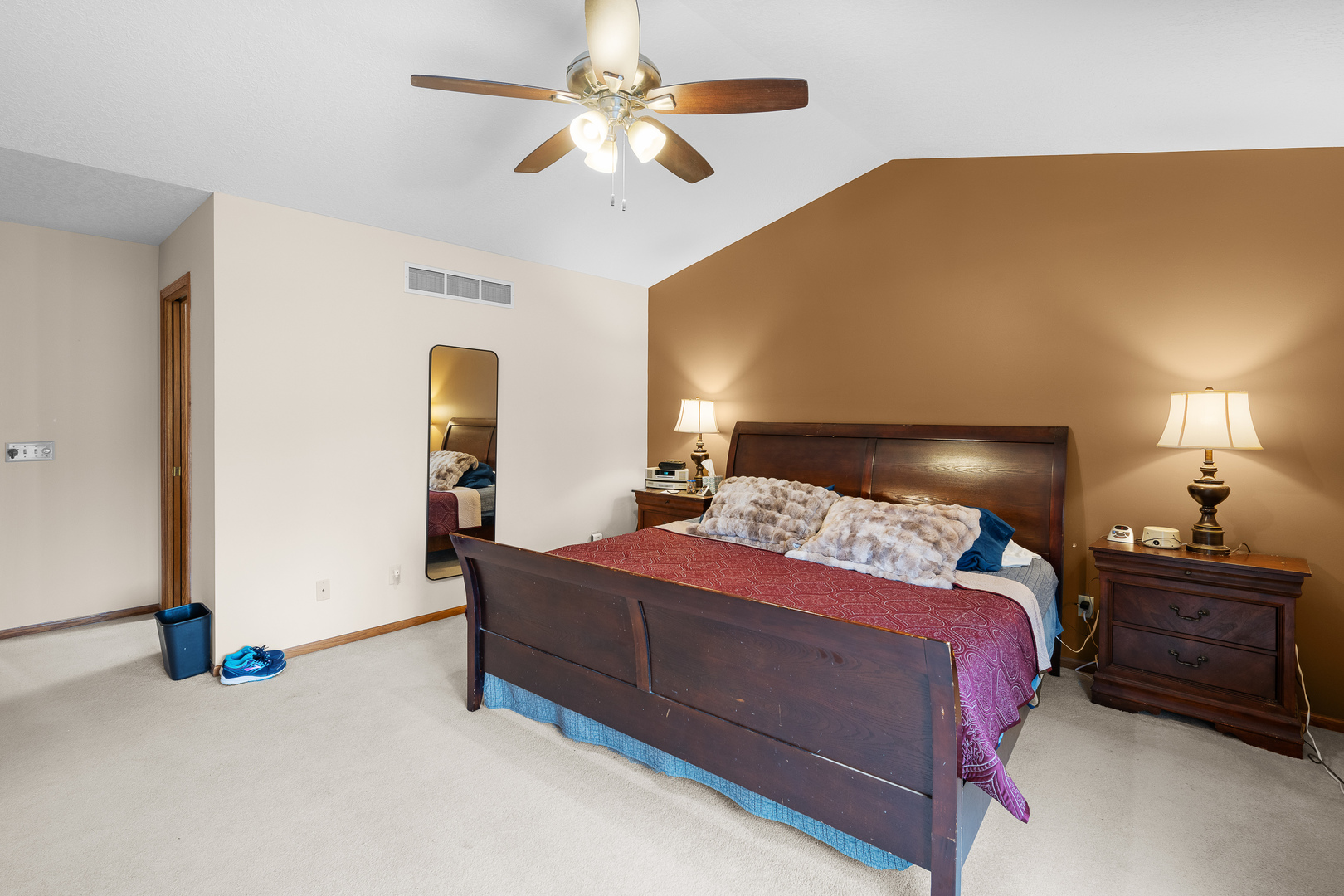 6002 Oakbrook Road Davenport, IA 52806 - Photo 27 of 50 a bedroom with a bed and a chandelier
