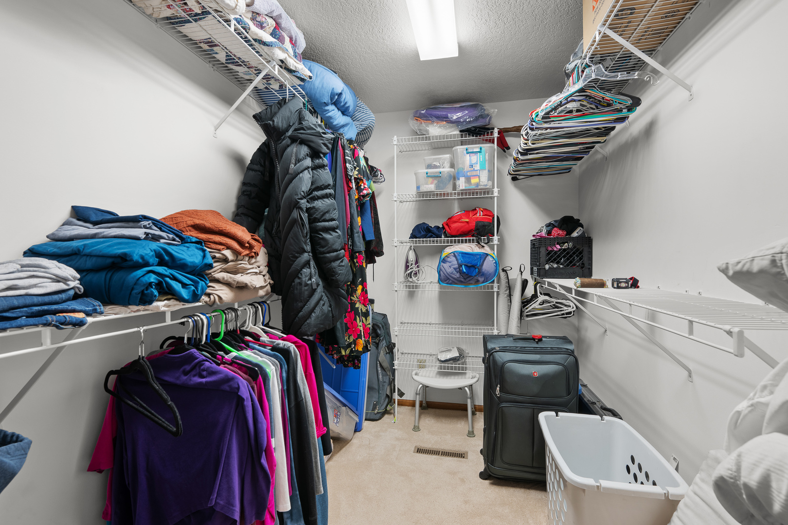 6002 Oakbrook Road Davenport, IA 52806 - Photo 28 of 50 a view of walk in closet with clothes and shoes