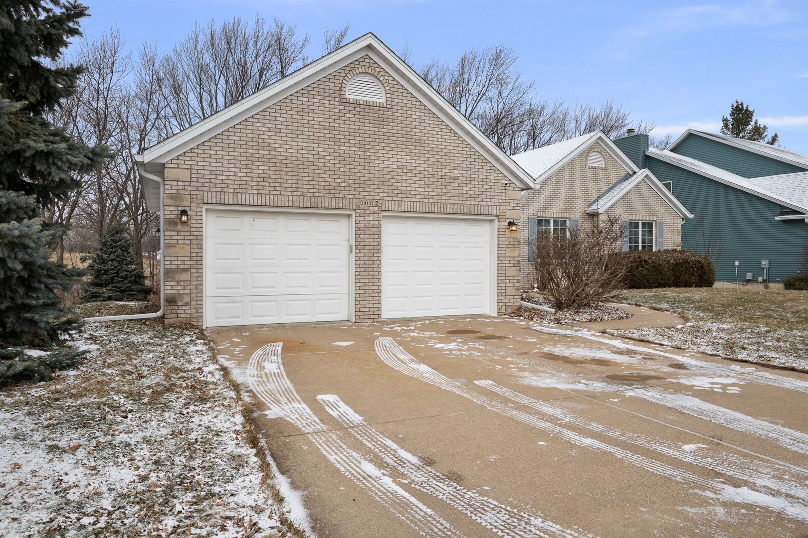 6002 Oakbrook Road Davenport, IA 52806 - Photo 3 of 50 a view of a house with a yard