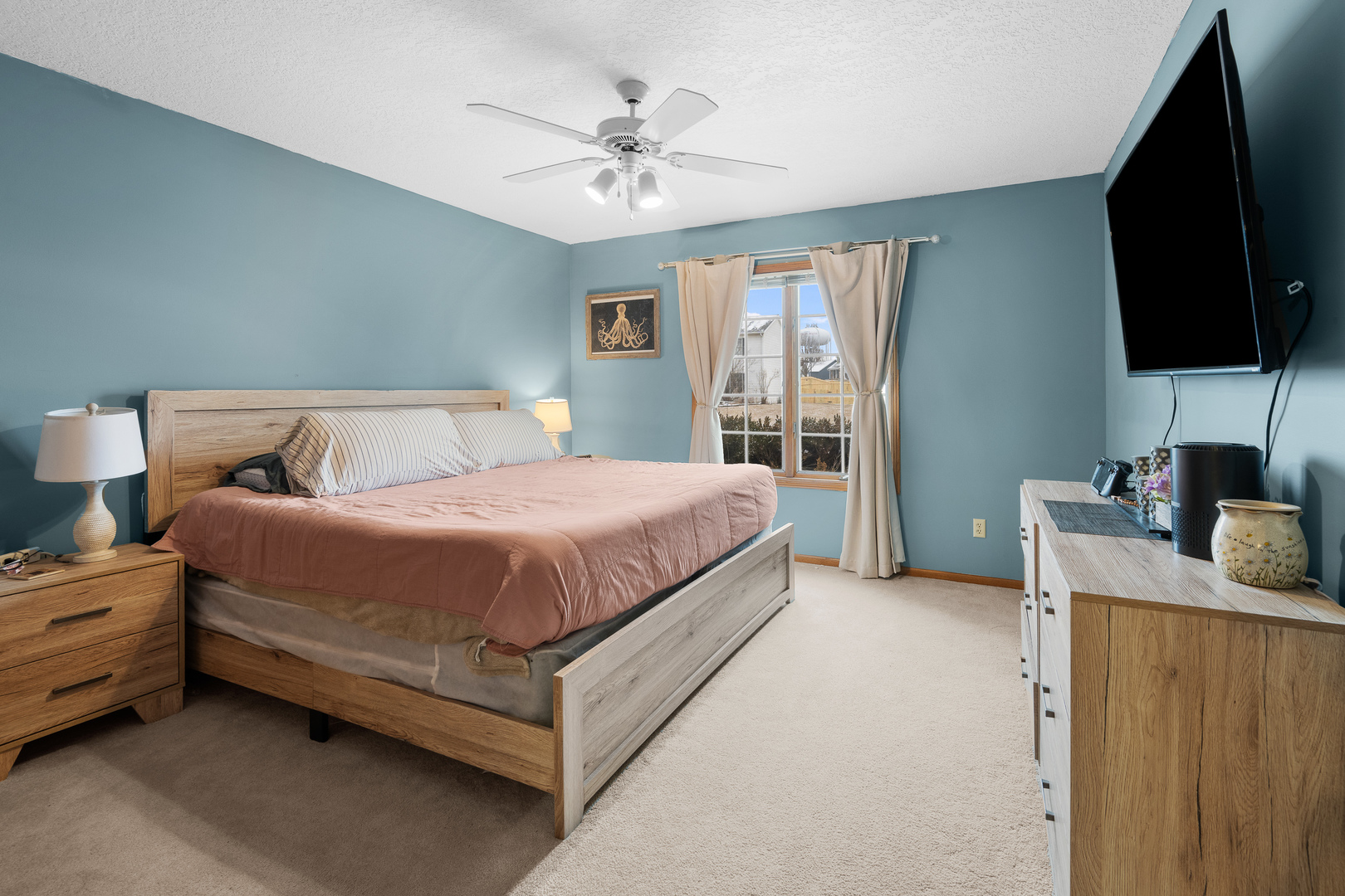 6002 Oakbrook Road Davenport, IA 52806 - Photo 32 of 50 a bedroom with a bed and a flat screen tv