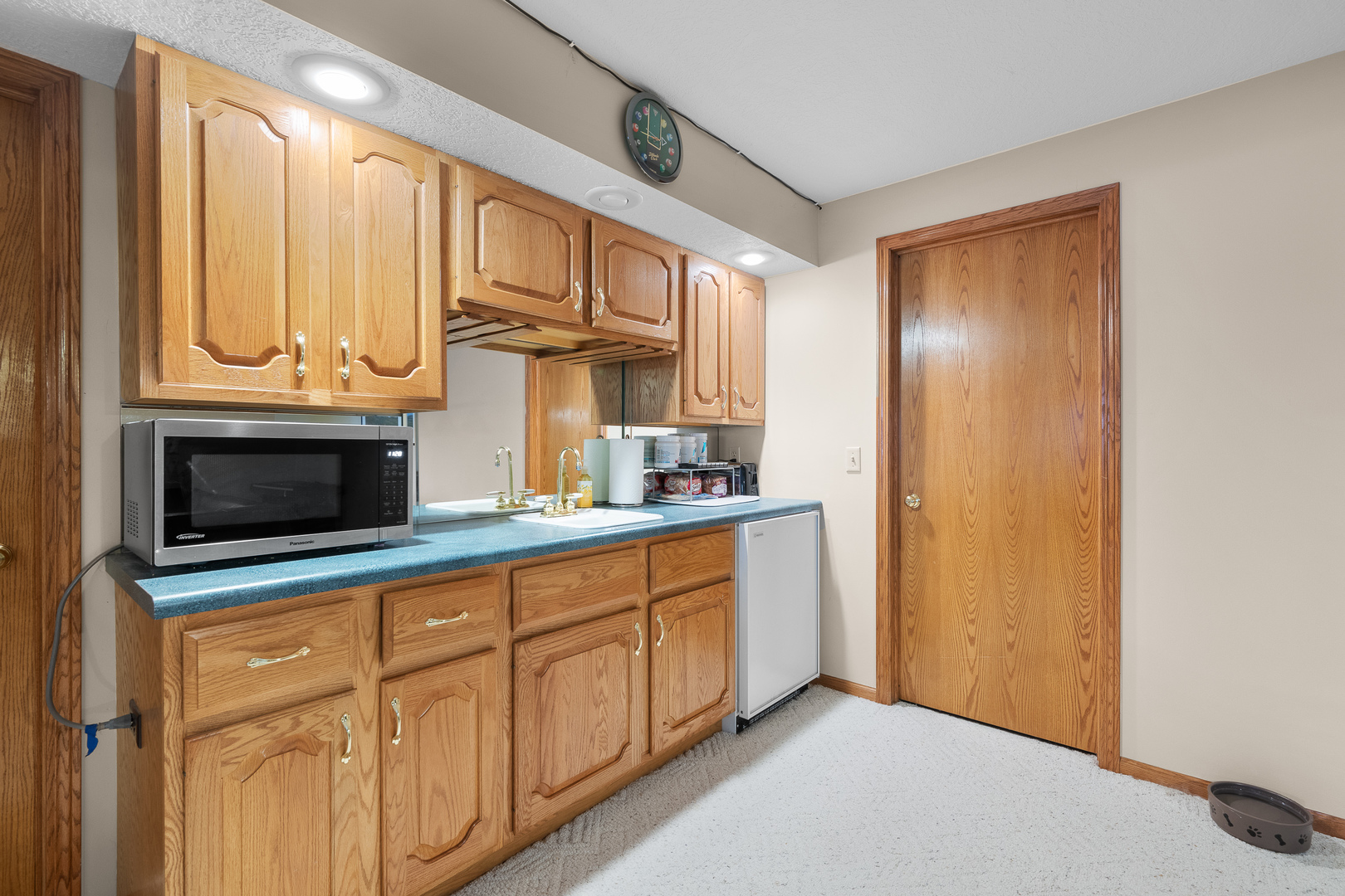 6002 Oakbrook Road Davenport, IA 52806 - Photo 42 of 50 a kitchen with stainless steel appliances granite countertop a refrigerator and a stove top oven